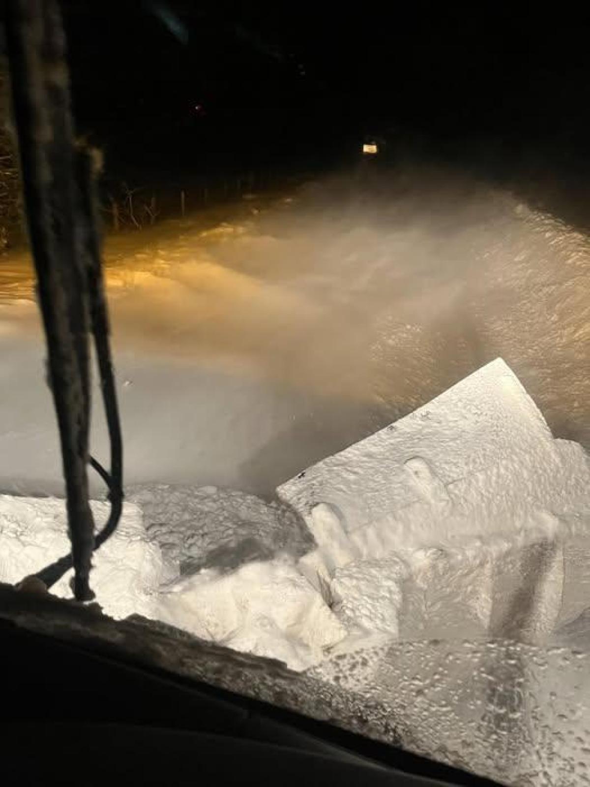A view out of the front of the snow plough window of the blocked road ahead