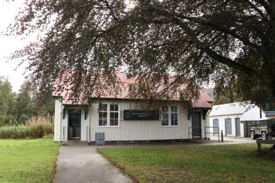 Visitor centre building with tree in the foreground