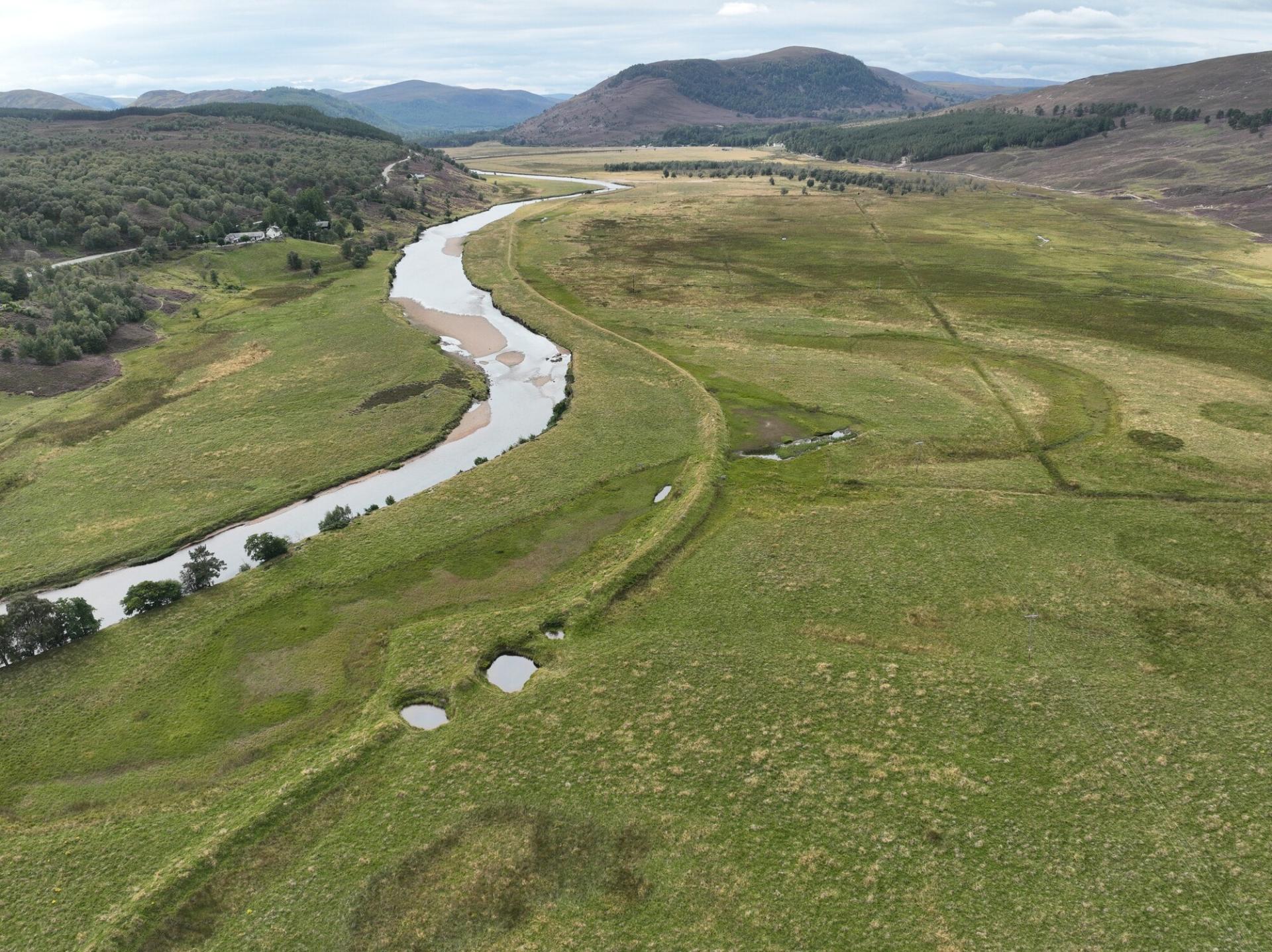 Aerial view of the Upper Dee floodplain and river showing prominence of flood bank