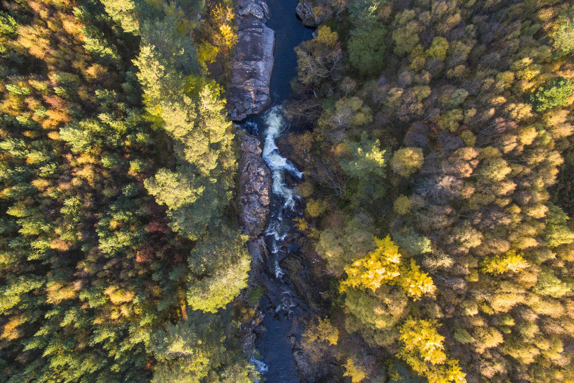 Aerial view of the Falls of Truim waterfall with surrounding trees