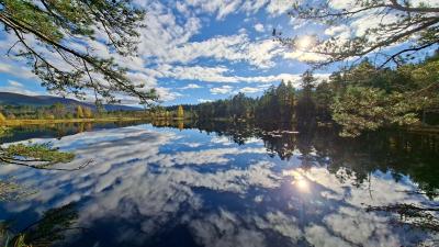 The clouds reflecting on the water at Uath Lochans
