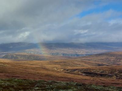 moorland with mist and rainbow in the distance