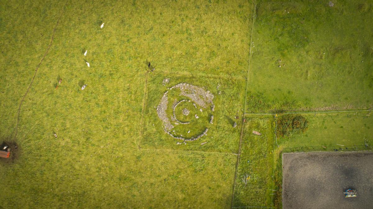 An aerial view of the Delfour Ring Cairn. Two circles of stone in a field.