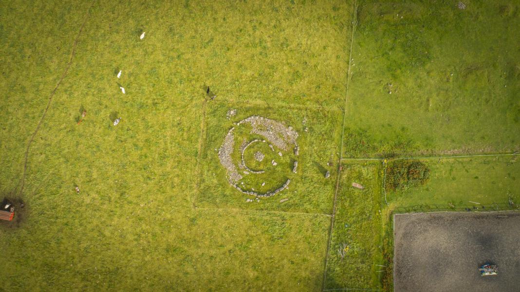An aerial view of the Delfour Ring Cairn. Two circles of stone in a field.