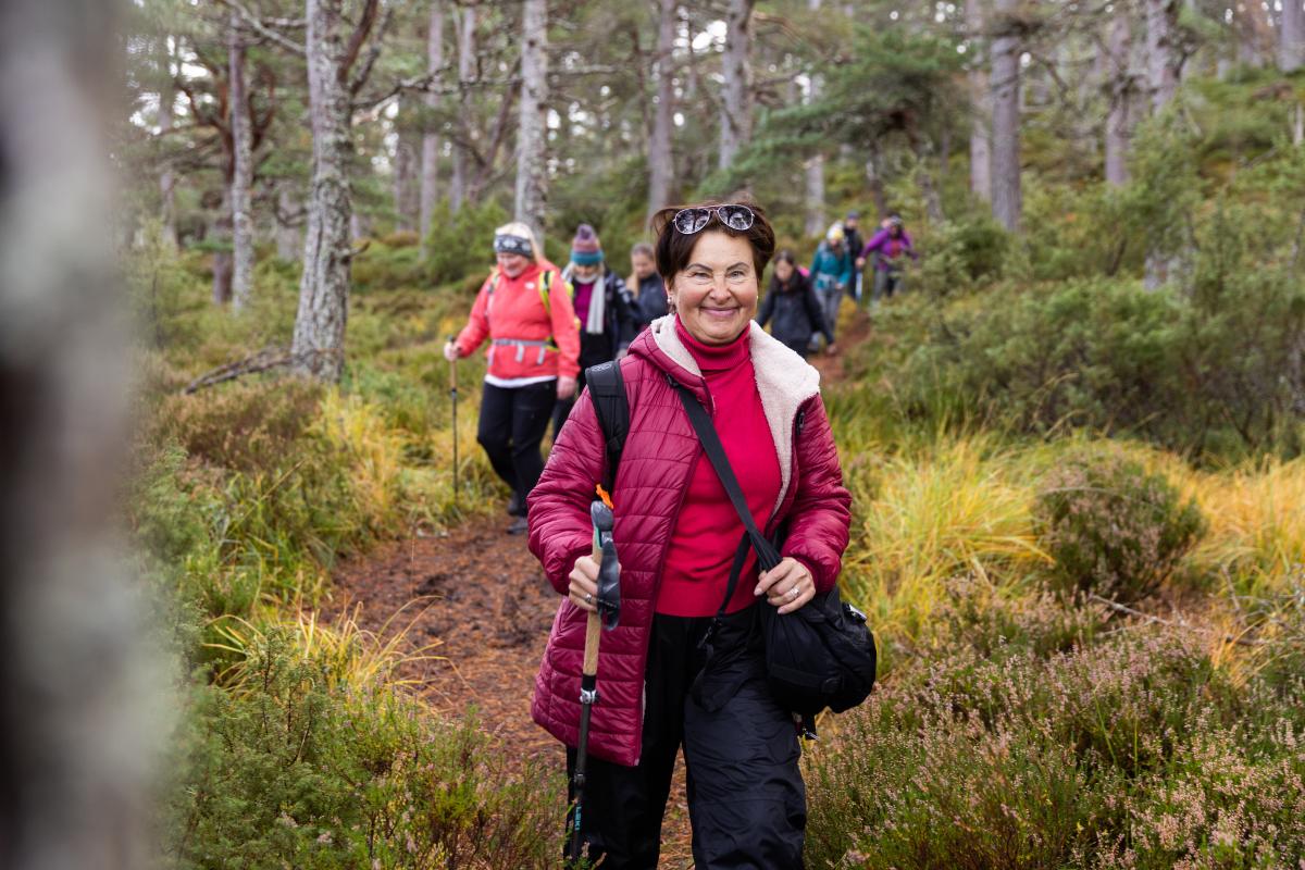 Group from the Community Champions Scheme walking in the forest.