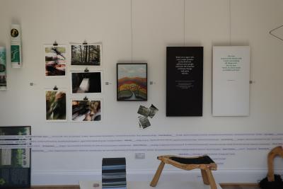 Various frames and arts hanging on the wall