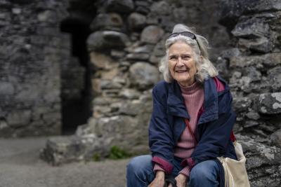 Jean sitting on a chair at Ruthven Barracks