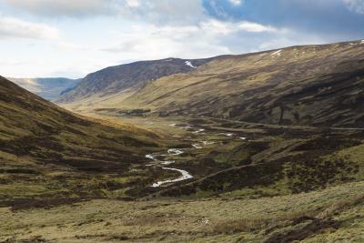 The view from the Devil’s Elbow, a dark green and brown glen with a stream running through