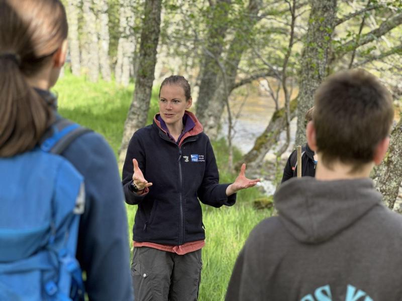 RSPB Forest Ranger Kirsty, leading a river kick sampling session.