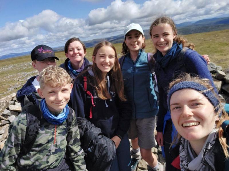 Cairngorms National Park Authority Seasonal Ranger, Fiona Brewis, with the Junior Ranger Deesiders