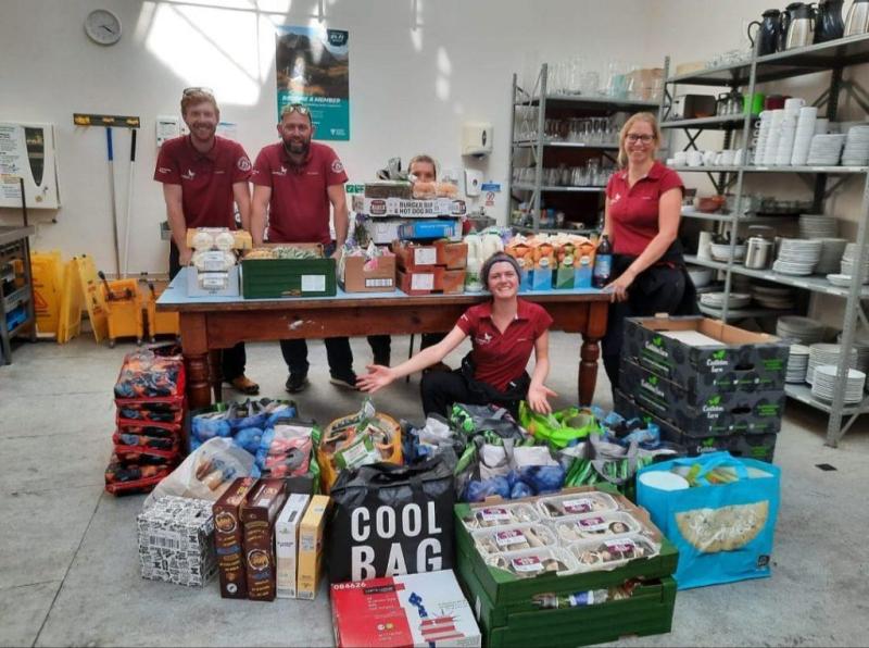 Cairngorms National Park Authority Rangers and Seasonal Rangers prepping food for the camp