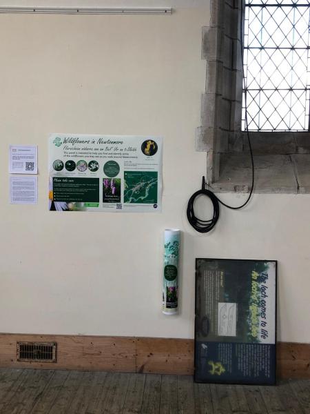 A room with a window and information panels on the wall