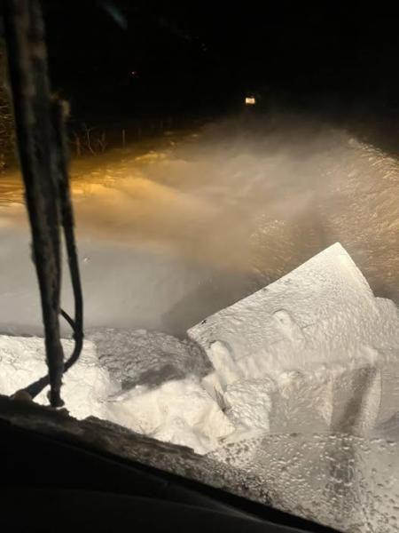A view out of the front of the snow plough window of the blocked road ahead