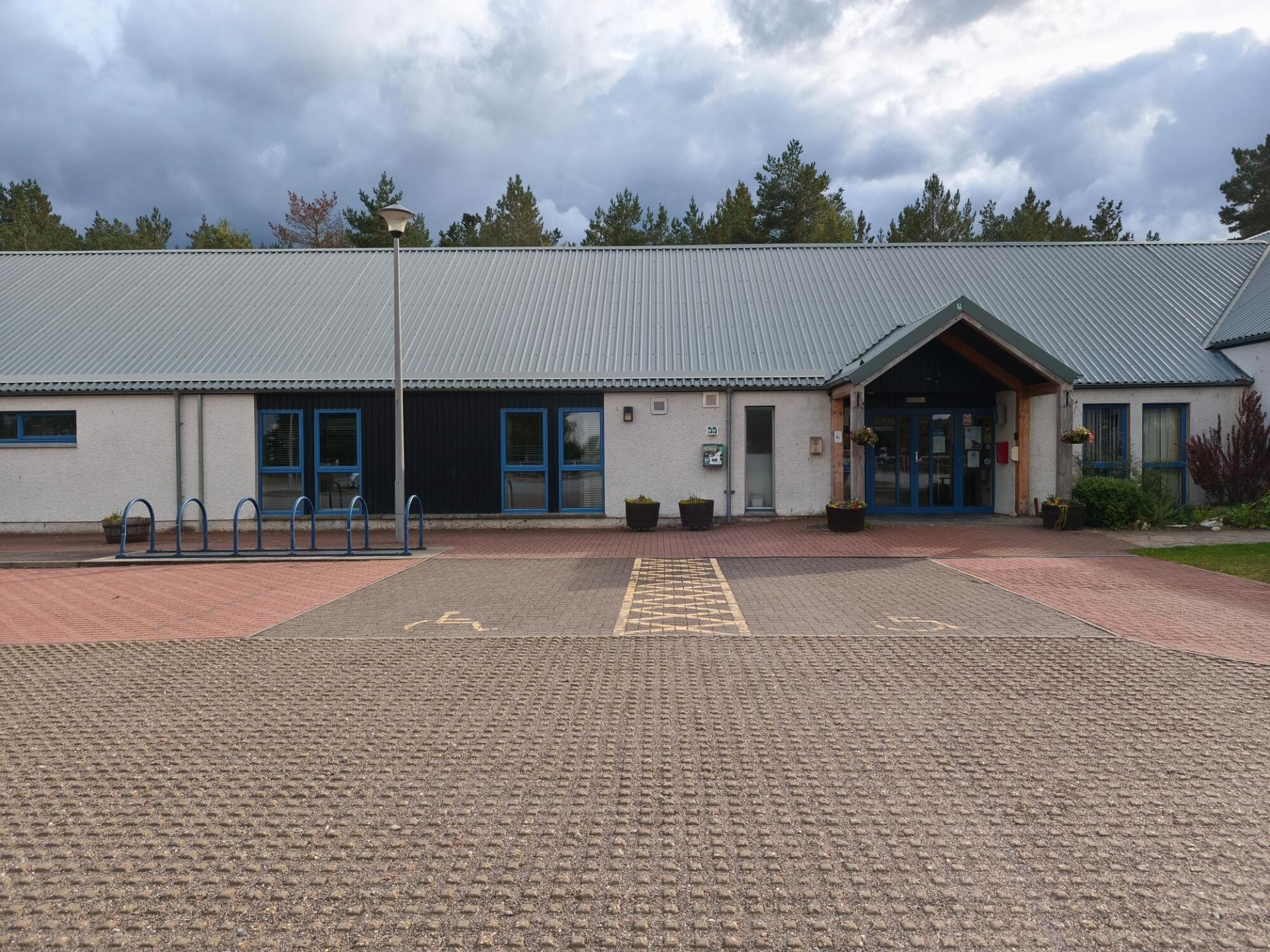 Two disabled parking bays outside the front doors of the Boat of Garten Community Hall