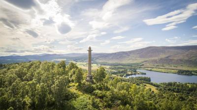 Aerial view of Torr Alvie monument with loch Alvie in the background.