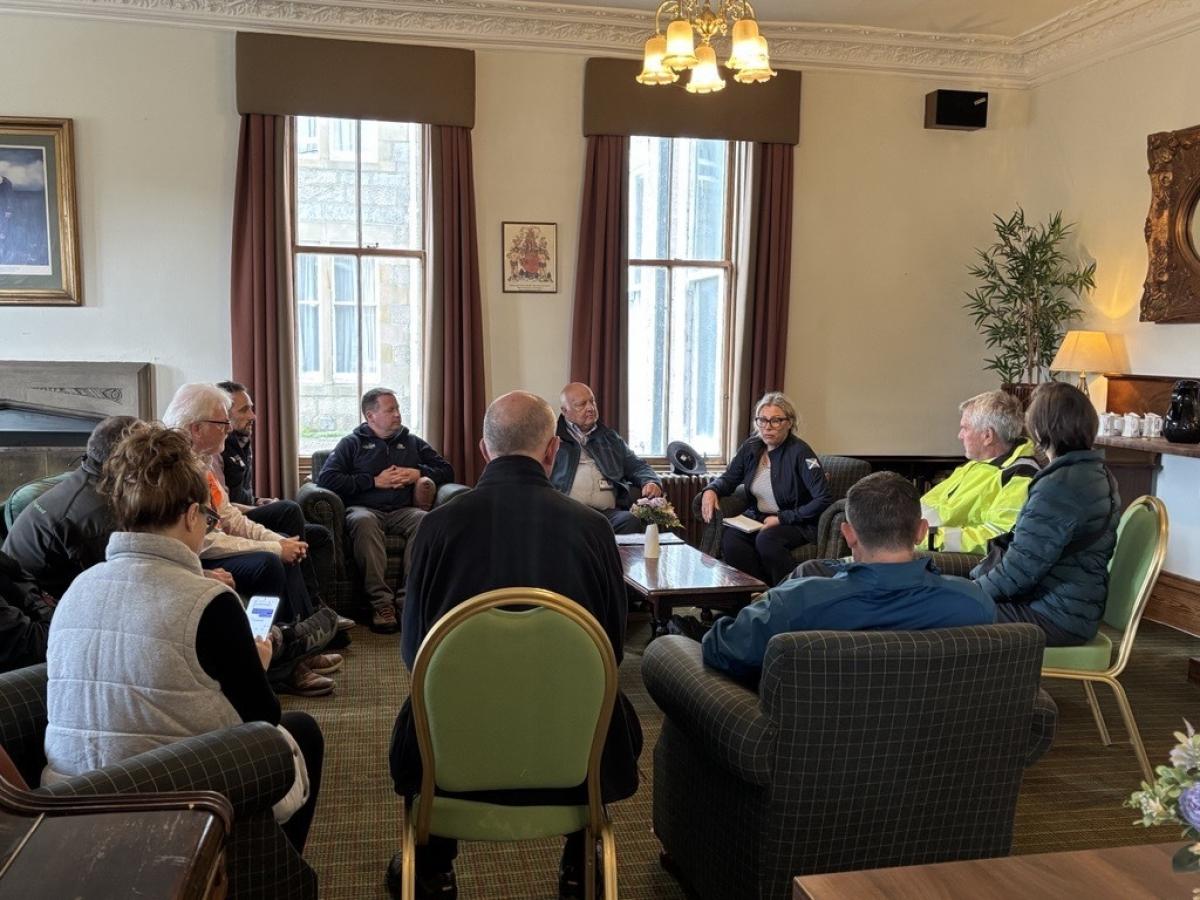 Lots of people gathered in a room
