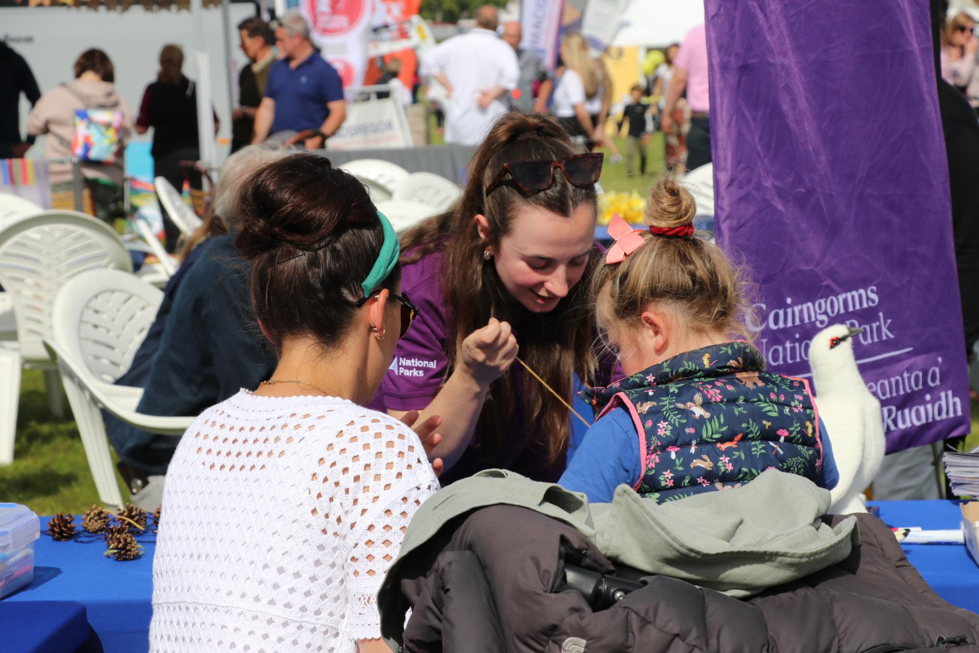 Person and child at outdoor engagement.
