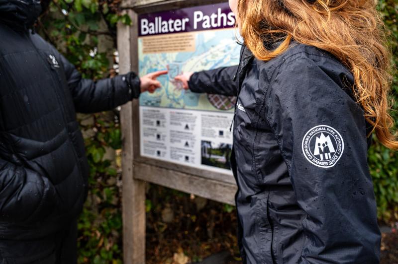 Seasonal ranger offering Ballater community path advice to a member of the public