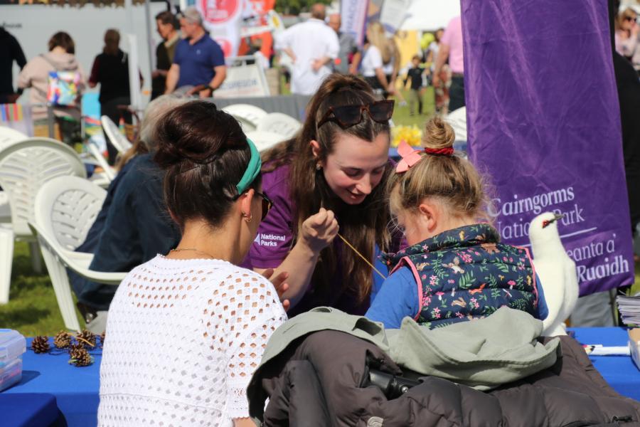 Person and child at outdoor engagement.
