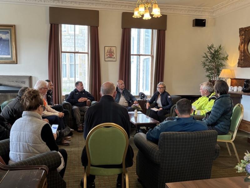 Lots of people gathered in a room
