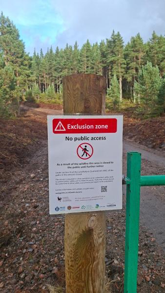 Sign on a post to inform the public about the exclusion zone caused by the wildfire.