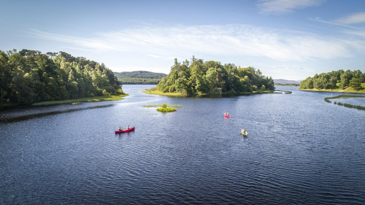 Six people in 3 kayaks on Loch Insh