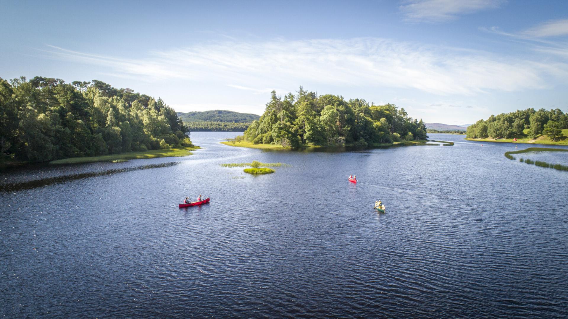 Six people in 3 kayaks on Loch Insh