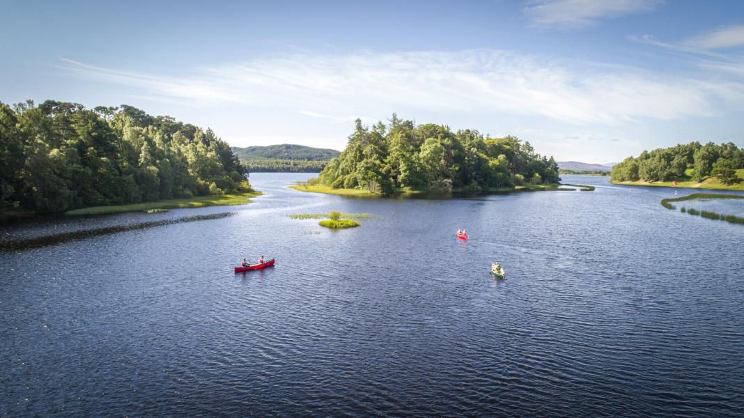 Six people in 3 kayaks on Loch Insh