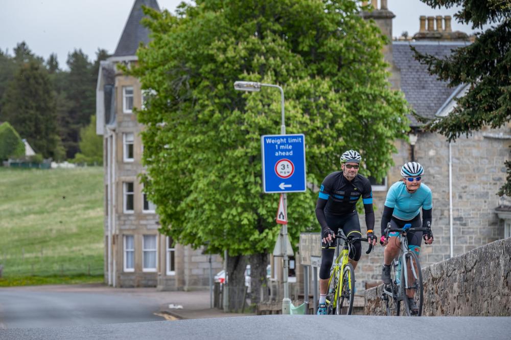 Cyclists crossing Nethy Bridge