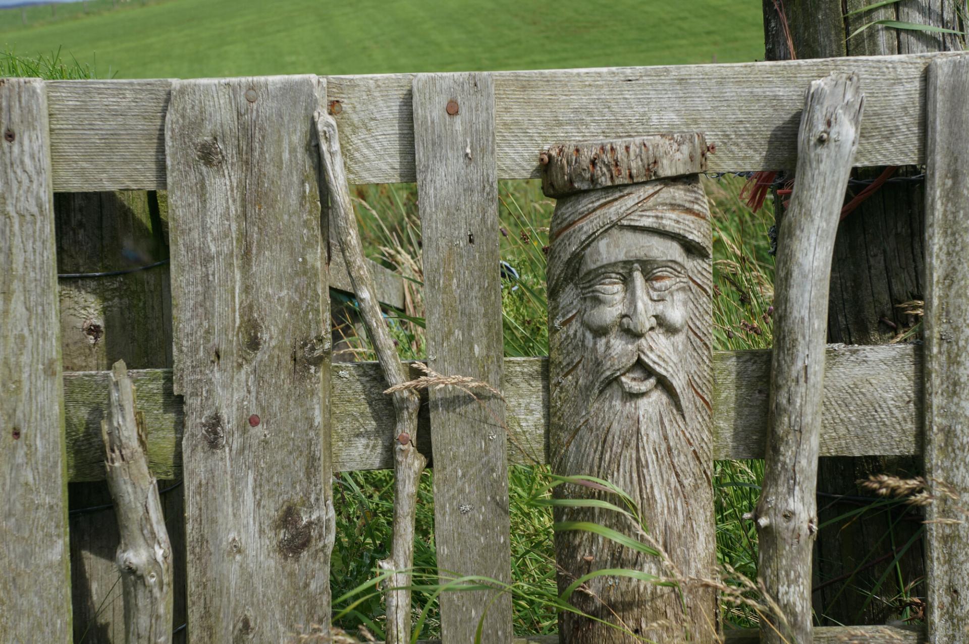 A carved fencepost