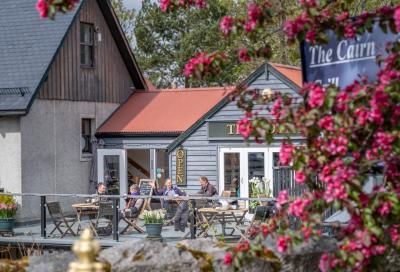 People sat outside the Bothy café in Braemar