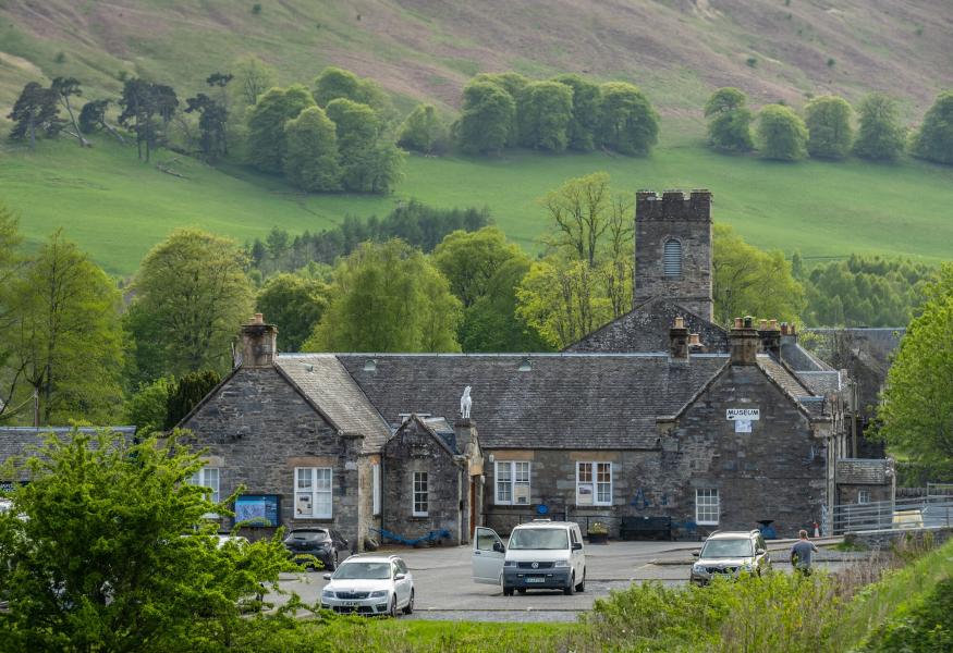 Cars parked outside old building in Blair Atholl