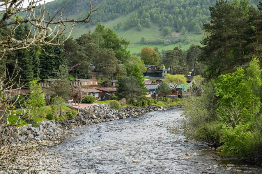 River Tilt flowing past holiday chalets in Blair Atholl