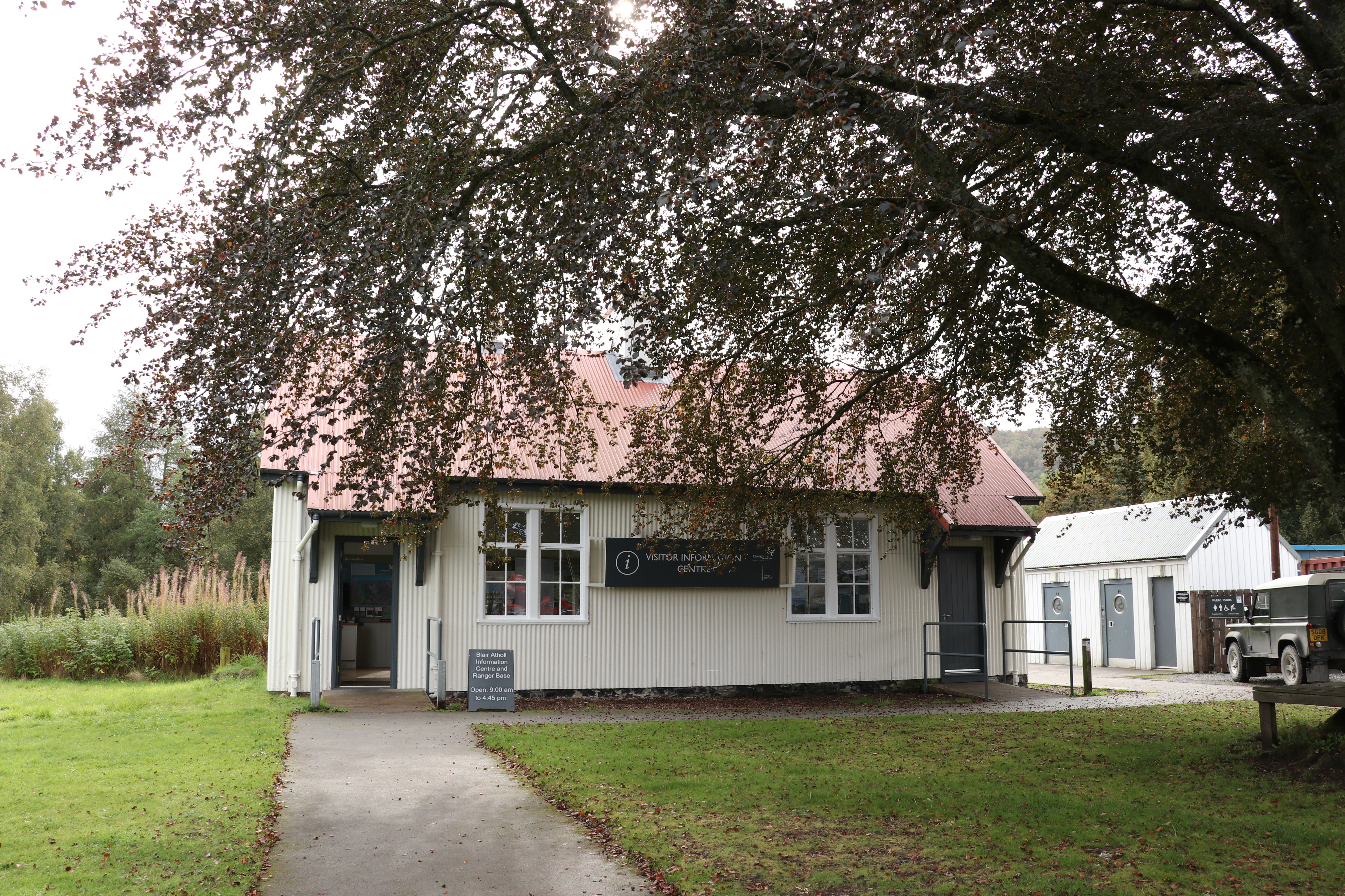 Visitor centre building with tree in the foreground