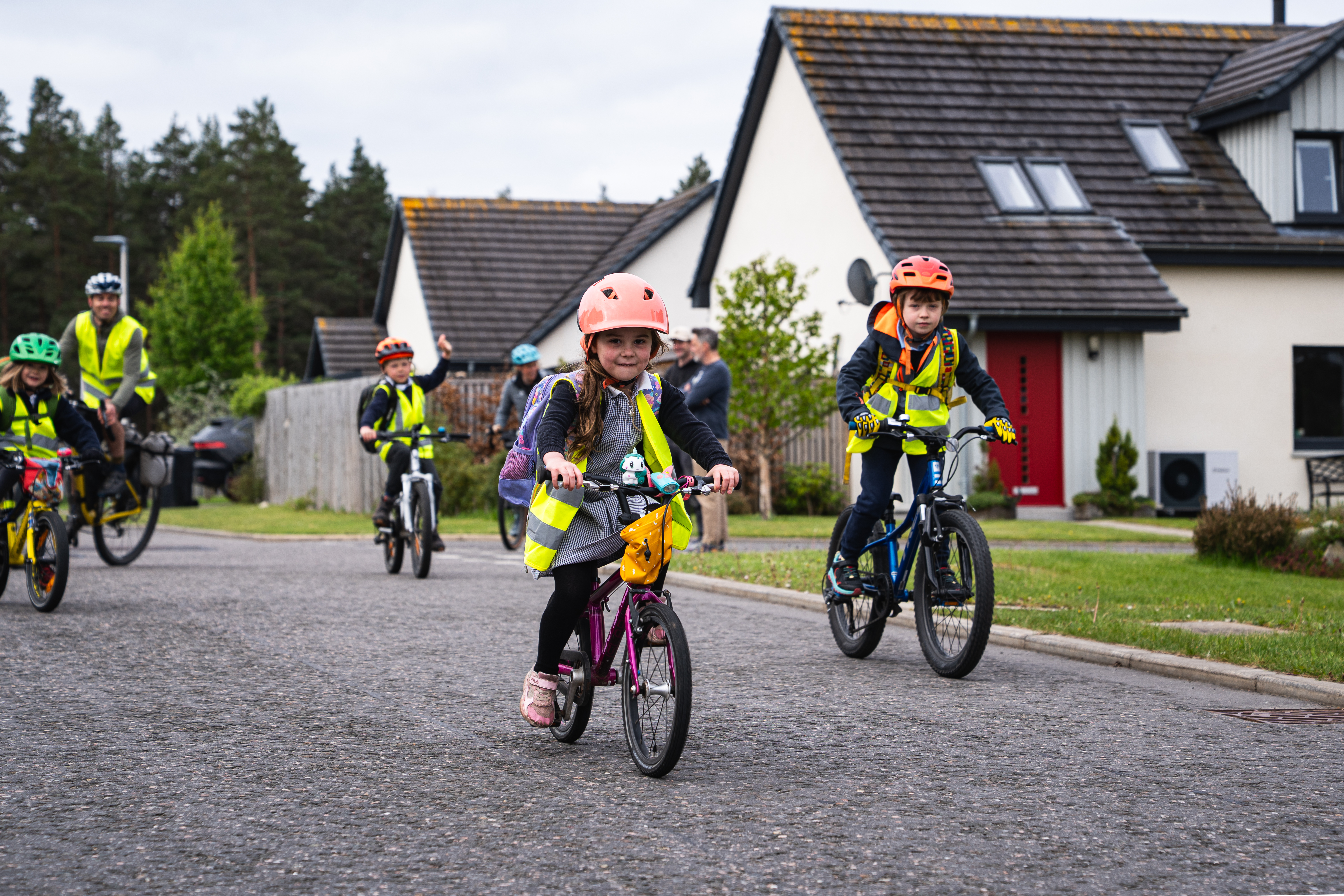 Photograph of children on a bike bus to school.