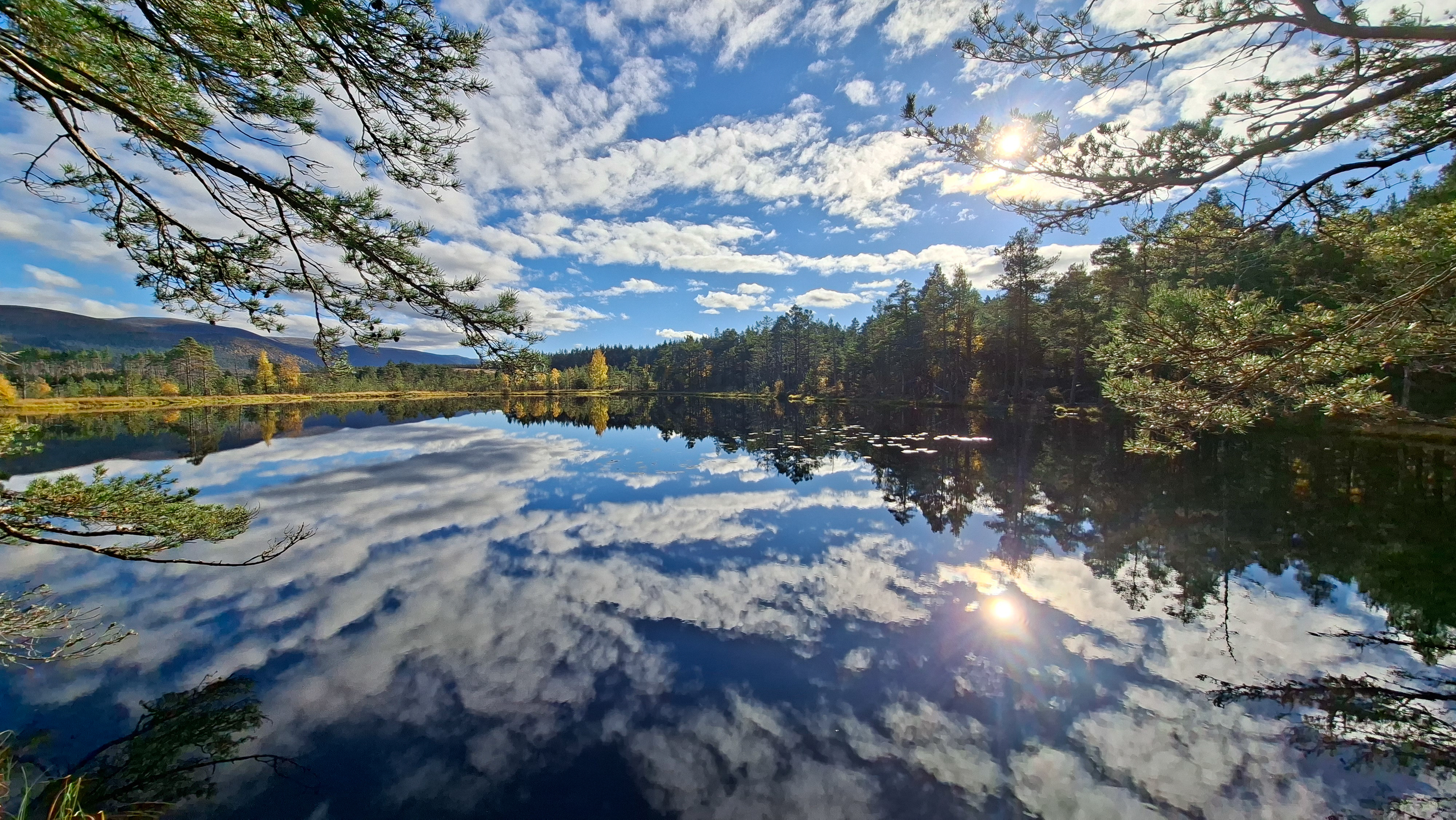 The clouds reflecting on the water at Uath Lochans