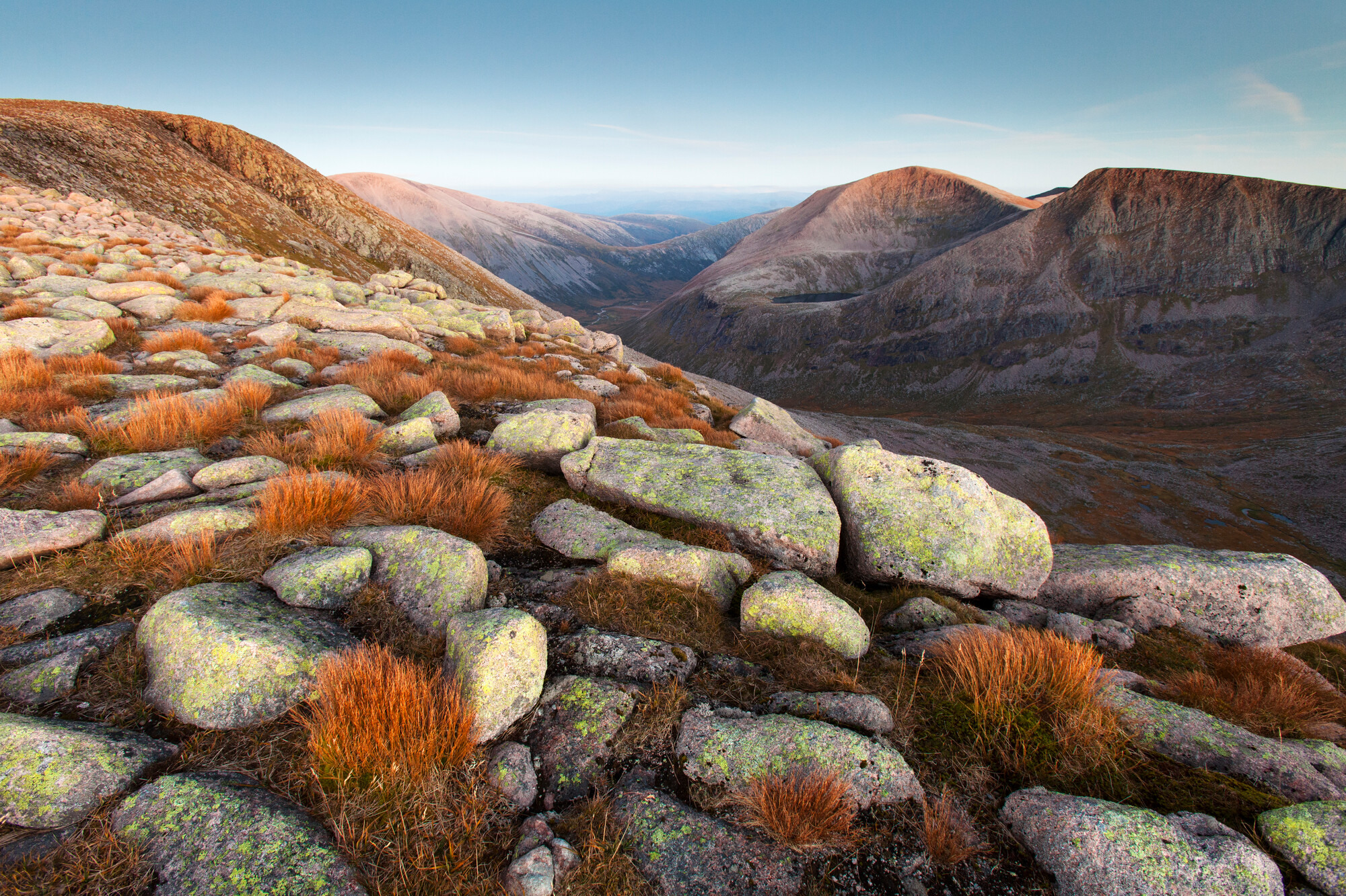 View over boulders to the Angel's Peak and Cairn Toul mountains from Braeriach