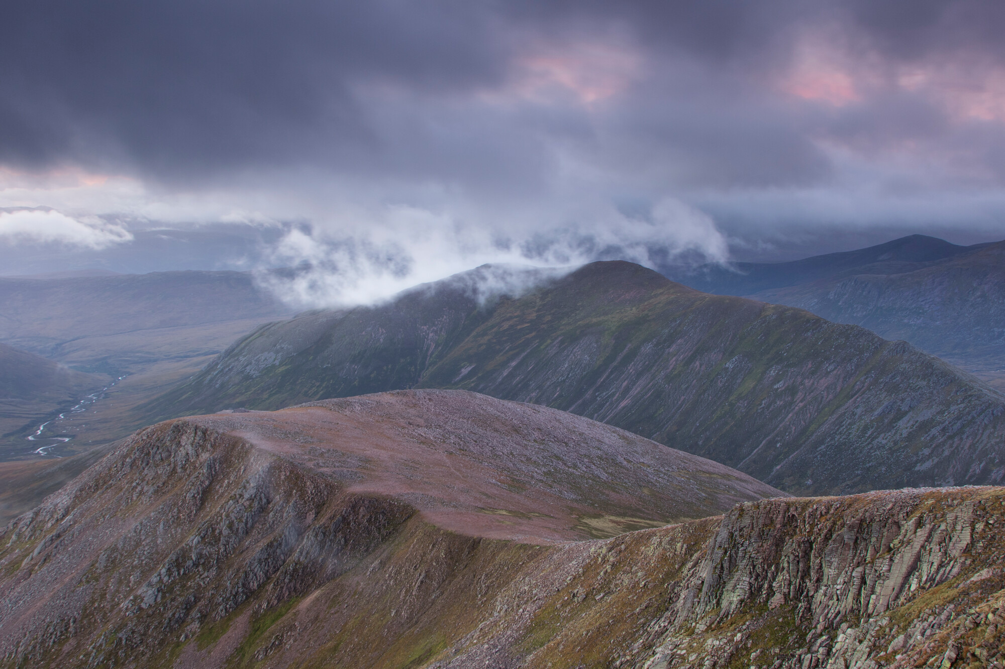 The mountains Sron Riach and Carn Mhaim in the Cairngorms on a cloudy day