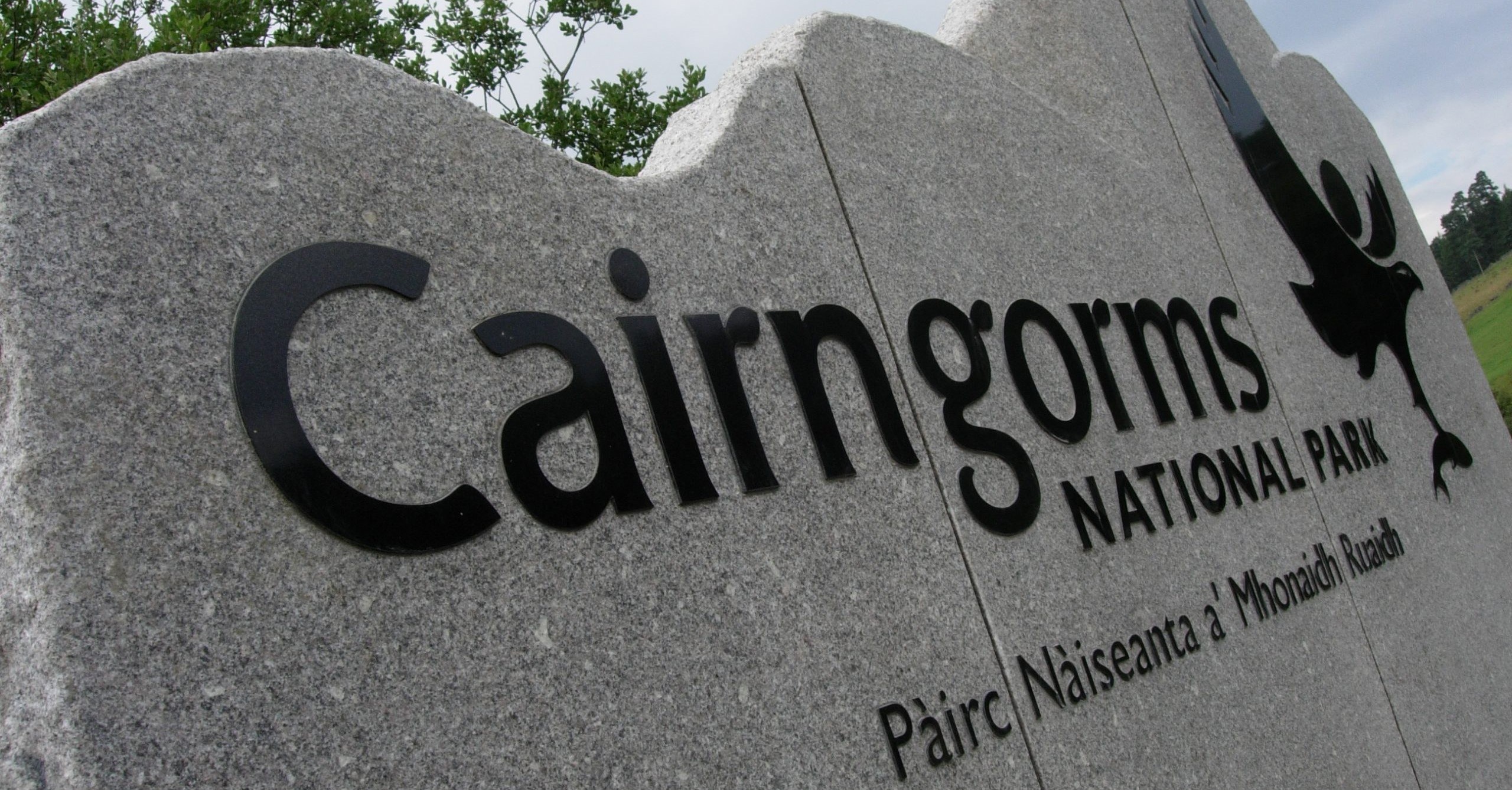 Photo of a granite marker at the entry to the Cairngorms National Park