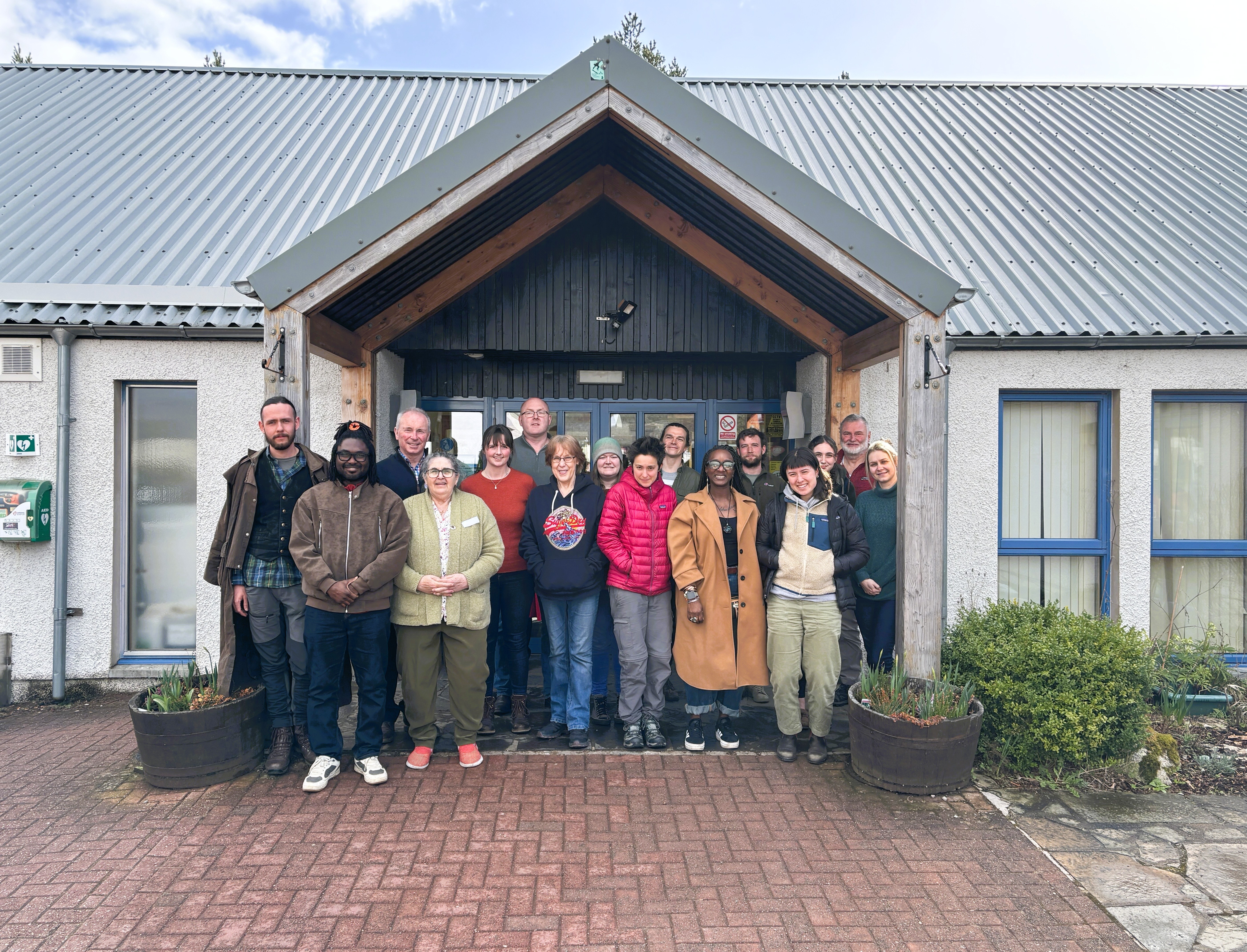 Members of the Cairngorms 2030 Communities Fund panel gather in front of Boat of Garten Community Hall