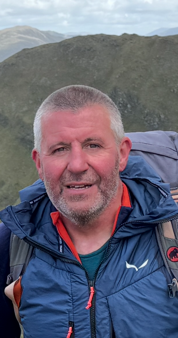 A photo of Bill Dallas of Braemar Mountain Rescue in the mountains