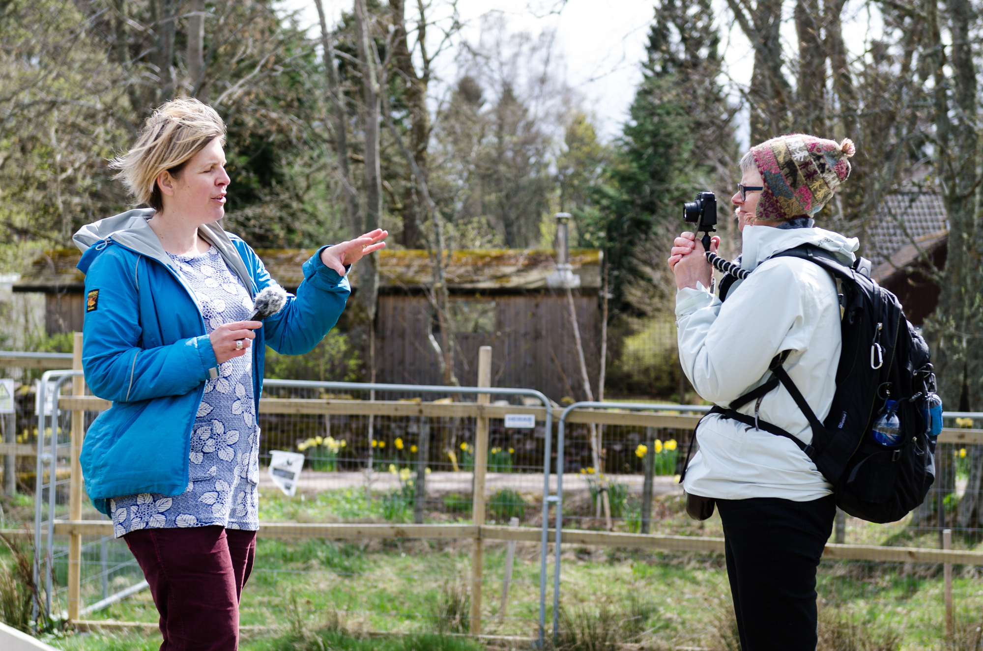 Two people creating a video report.