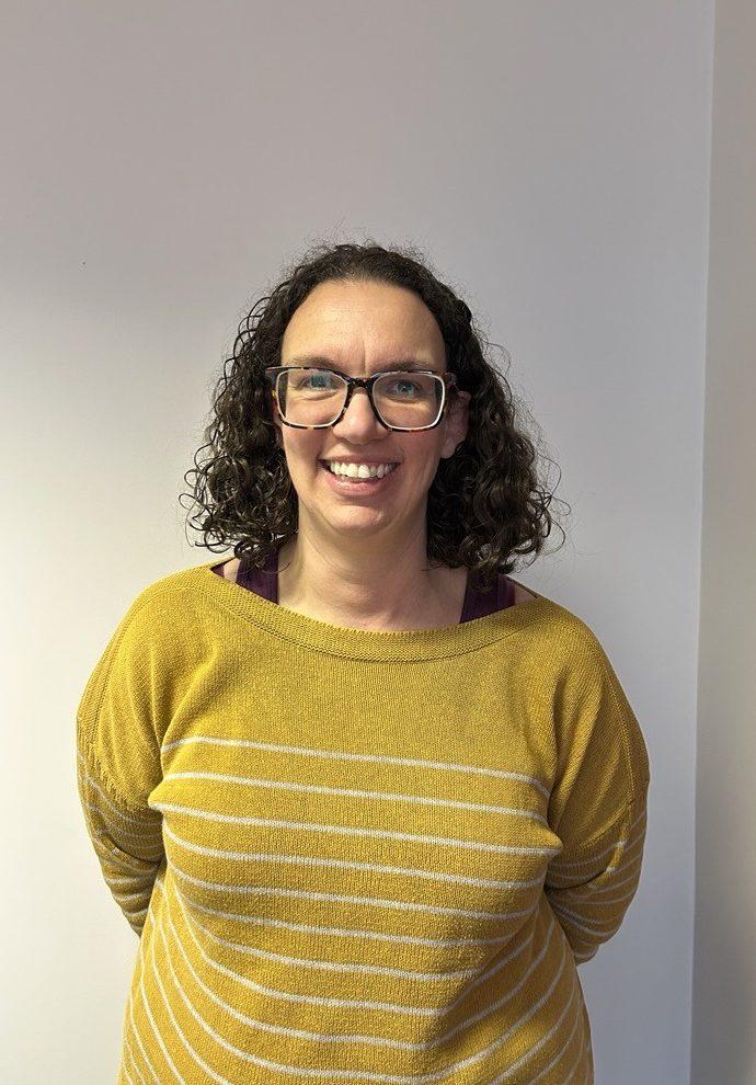 A smiling photograph of a woman
