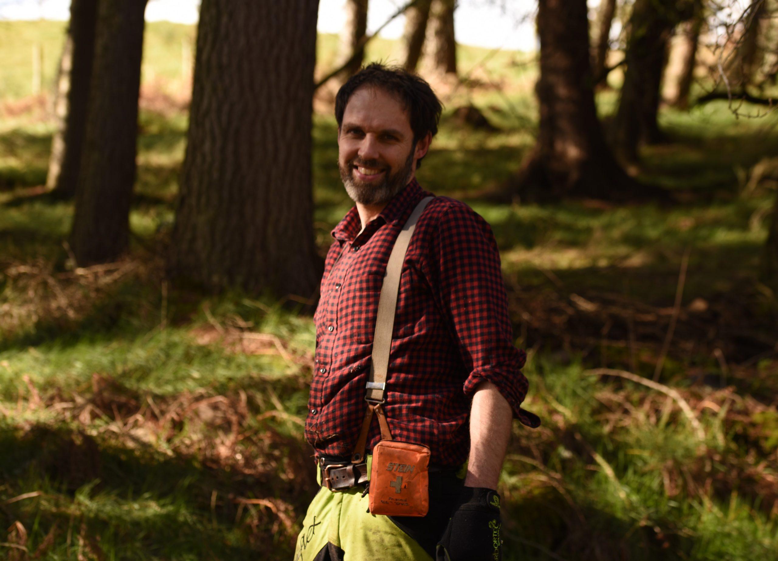 Image of David Tompkins standing in woodland