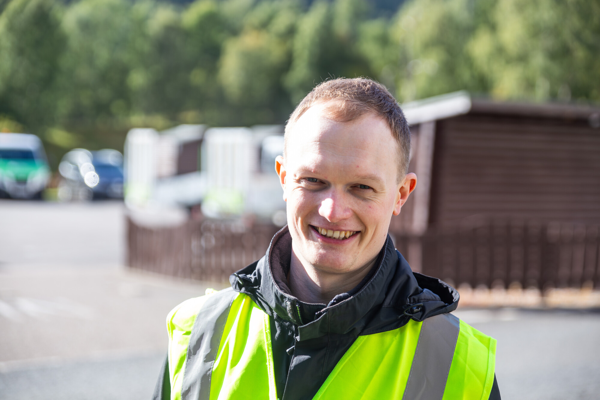 James Ade wearing a high vis vest outdoors.