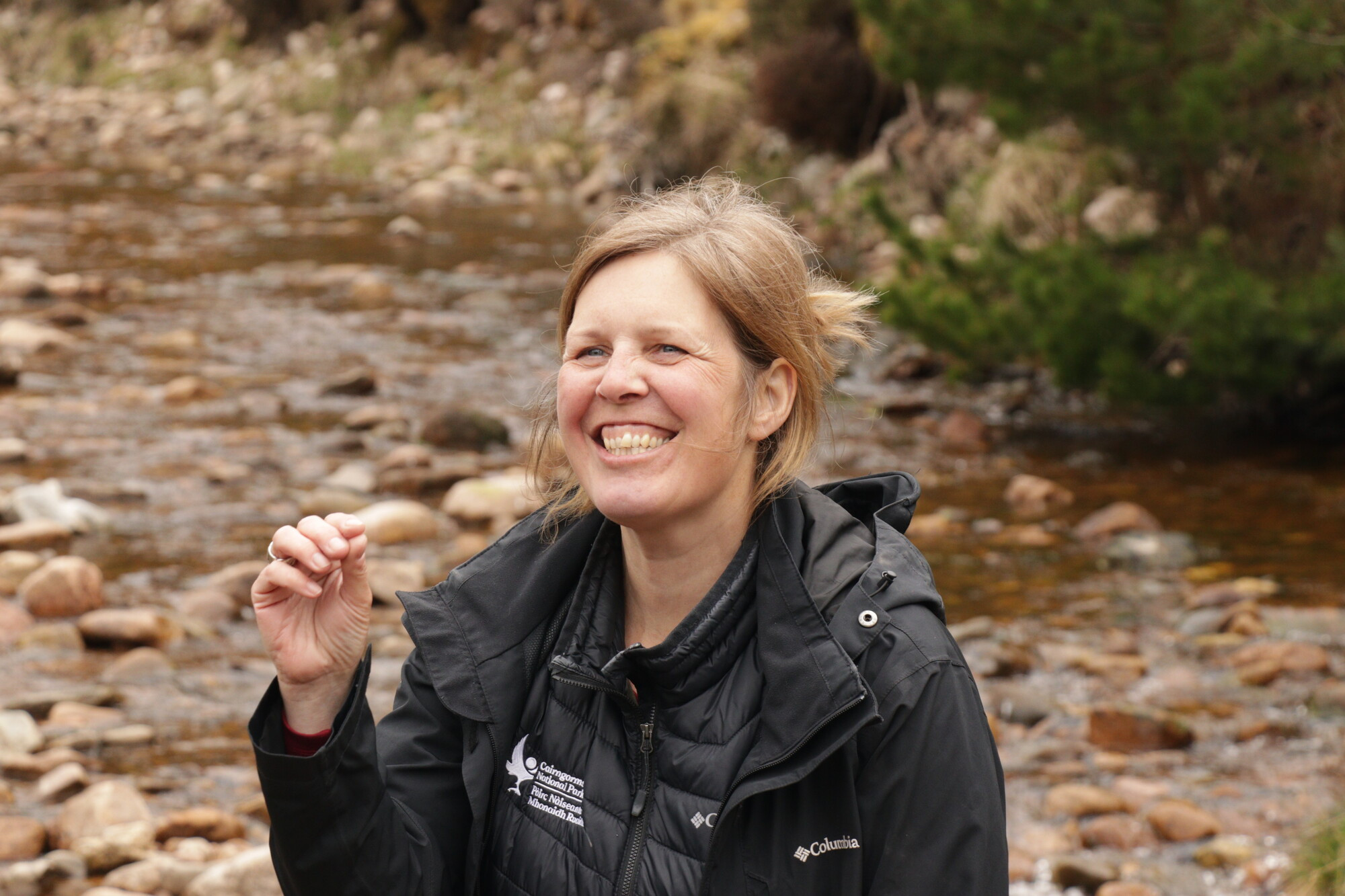 A head and shoulders photo of Dr Sally Mackenzie next to a burn