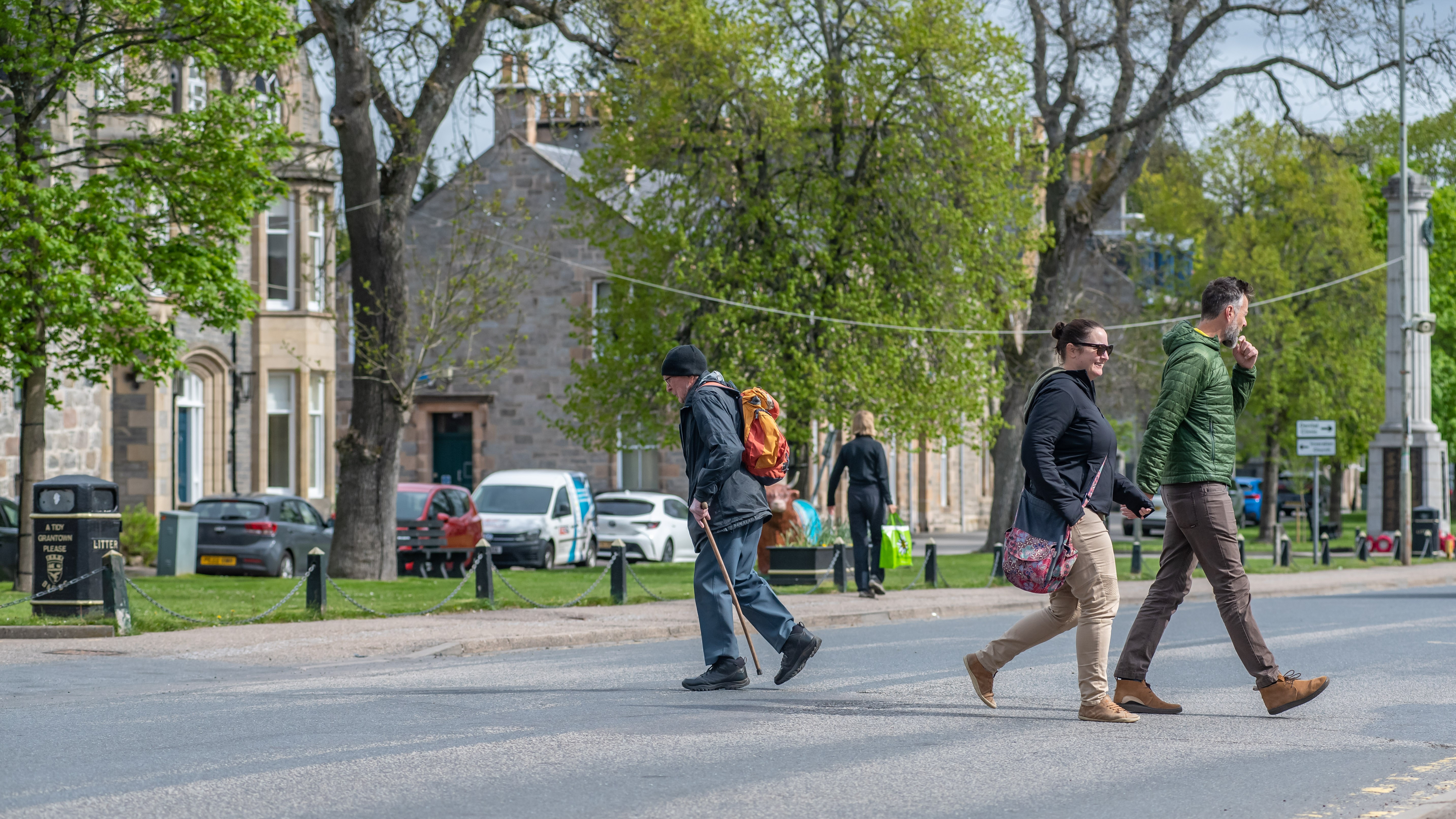 People cross the main road in Grantown-on-Spey.