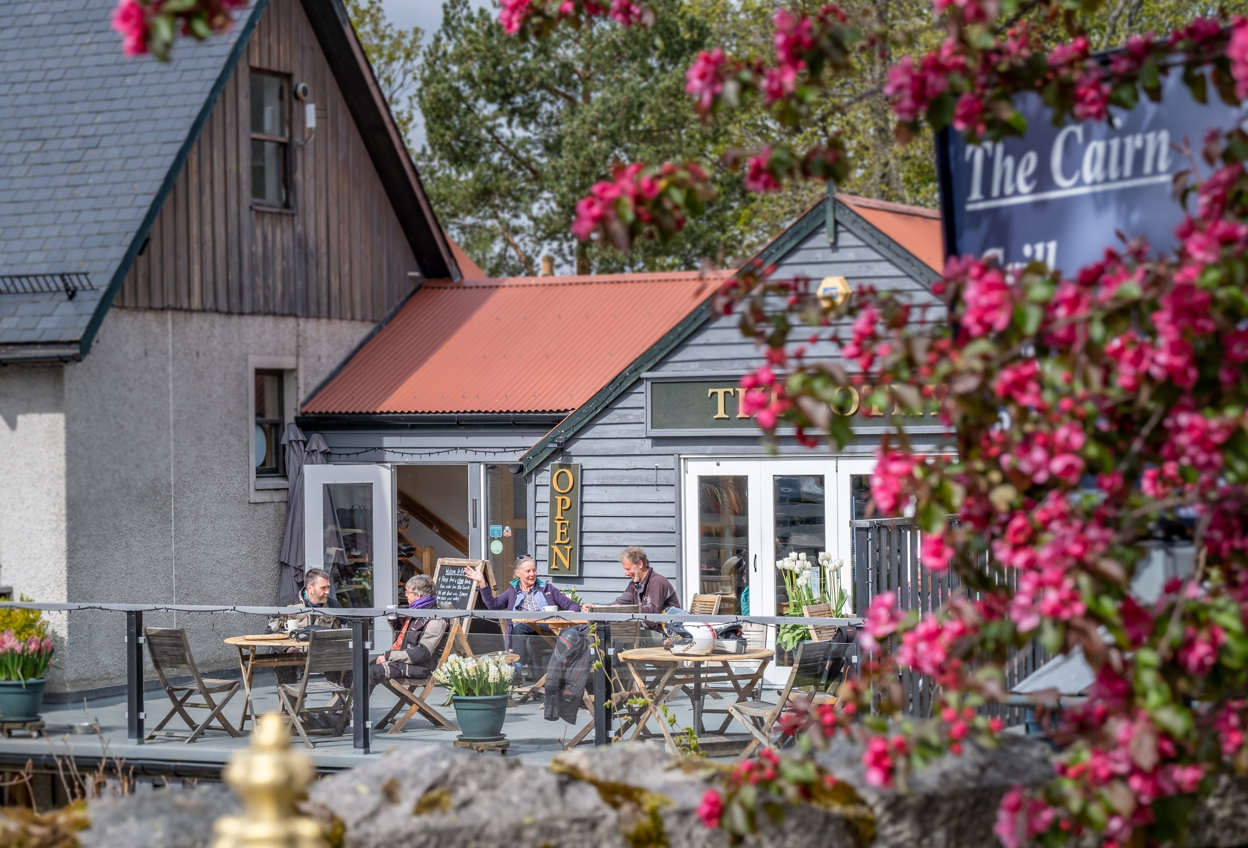 People sat outside the Bothy café in Braemar