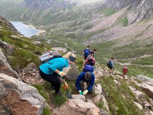 Volunteers working on maintaining a mountain path